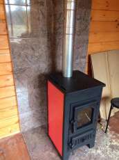 Купить стальной камин Везувий ПК-01 (270) в Гродно фото в интерьере в Гродно