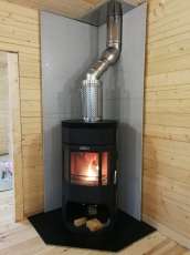 Недорогой камин с отделкой шамотом Сибирь 12 фото в интерьере в Гродно