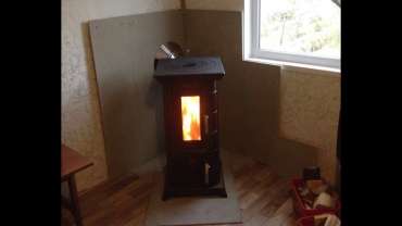 Отопительная печь Термофор Статика Тетра, чёрная бронза фото в интерьере в Гродно