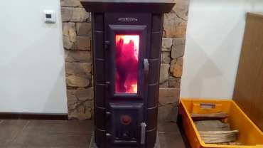 Стальная печь Термофор Статика Тетра, чёрная бронза фото в интерьере в Гродно