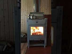 Стальной камин со стеклом Теплодар Кадриль фото в интерьере в Гродно