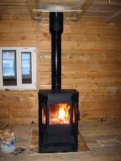 Печь-камин Бавария водяной с плитой в интерьере в Гродно