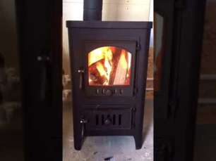 Чугунный недорогой камин со стеклом Бавария Оптима Чугун с плитой фото в интерьере в Гродно