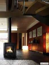 Печь-камин чугунный Invicta Carolo в интерьере Амазонка бай фото  в Гродно