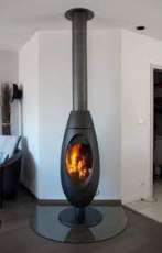 Печь-камин чугунный Invicta Ove в интерьере Амазонка бай фото в Гродно